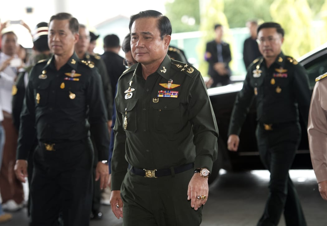 General Prayut Chan-O-Cha (centre) arrives for a meeting at the Army Club in Bangkok on Tuesday.