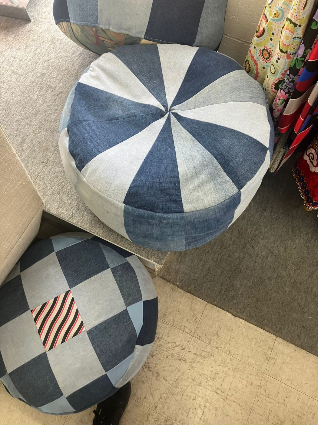 Photo shows an ottoman made with old jeans.