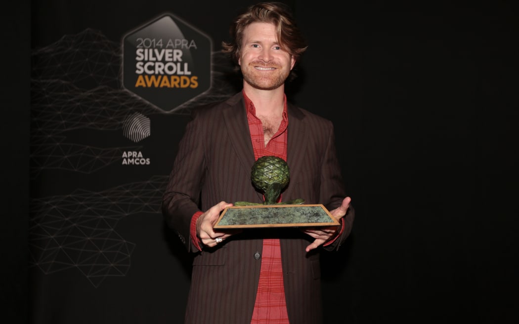 Tom McLeod accepts the Best Original Film award for 'Girl Vs Boy' at the 2014 Silver Scroll Awards at TSB Arena