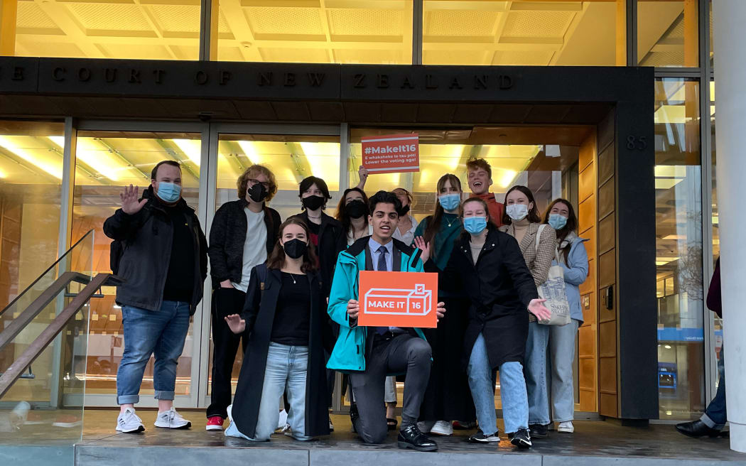 Make it 16 campaign members standing outside of the Supreme Court in Auckland after pleading their case.