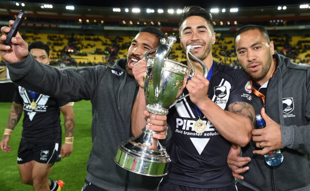 Savili Havili, Shaun Johnson and Suaia Matagi celebrates after defeating Australia in the Four Nations Rugby League Final.