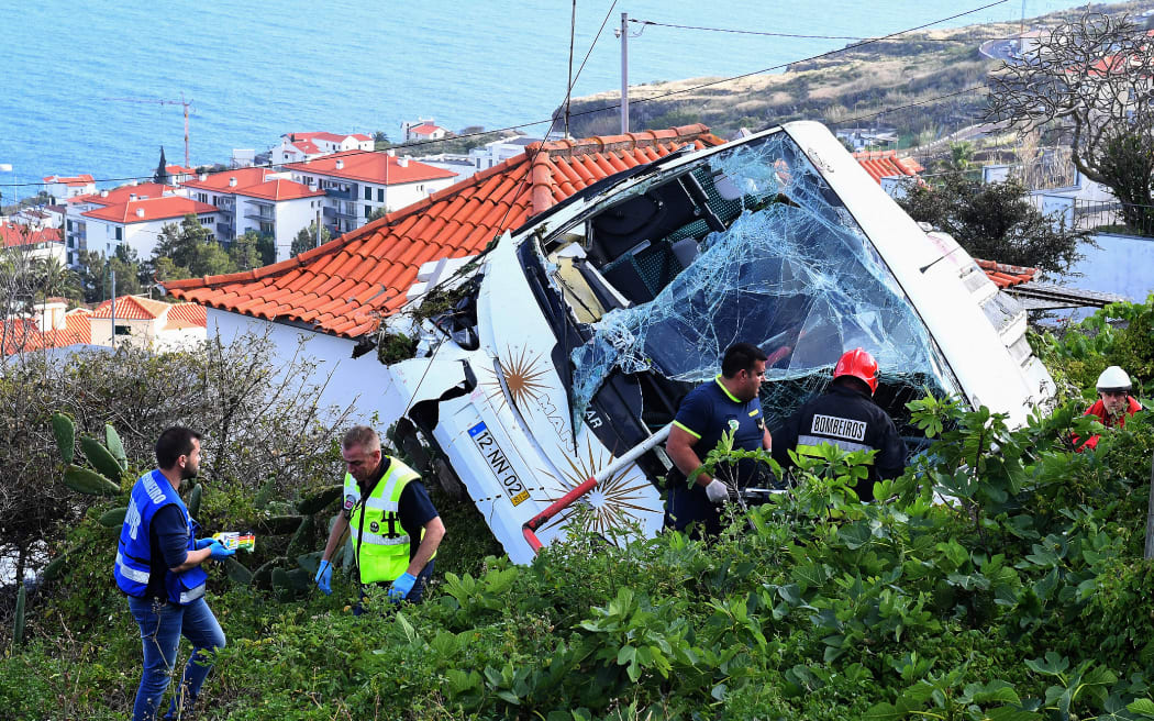 The wreckage of a tourist bus that crashed in Caniço, on the Portuguese island of Madeira.