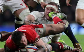 England's flanker Sam Underhill is kicked in the face by Wales' flanker Alex Mann during the Six Nations international rugby union match between England and Wales at Twickenham Stadium in south-west London, on February 10, 2024. (Photo by Adrian DENNIS / AFP)