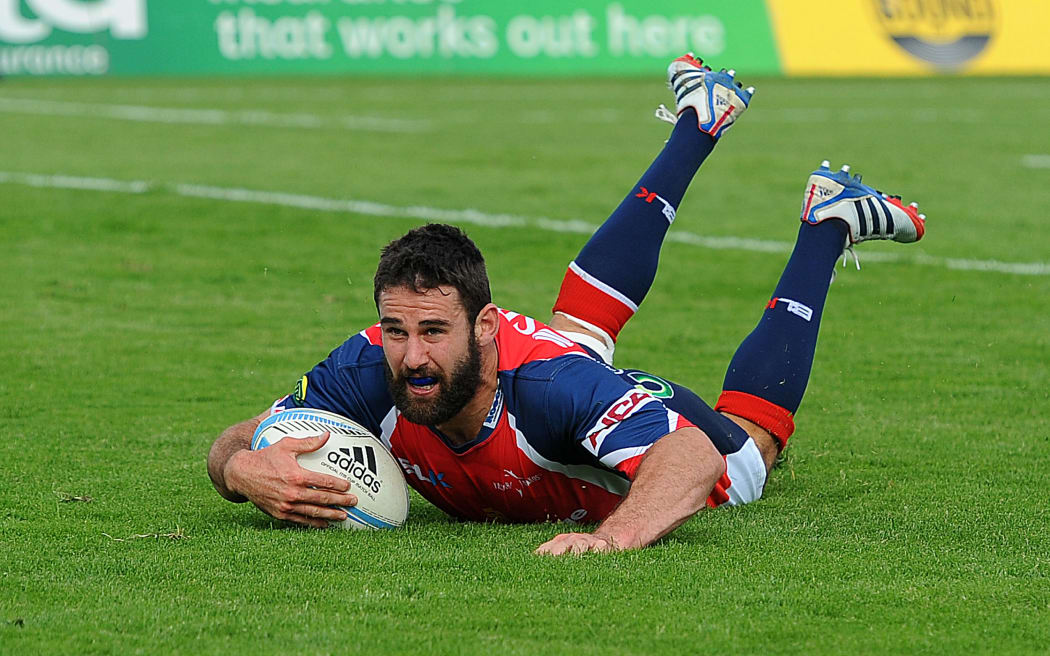 Billy Guyton scores for Tasman against Manawatu in 2013.