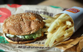 In this photo illustration, a Burger King Whopper hamburger is displayed on 5 April 2022 in San Anselmo, California. A federal lawsuit has been filed and is seeking class-action status alleging that fast food burger chain Burger King is misleading customers with imagery that portrays its food, including the Whopper burger, as being much larger than what is actually being served to customers. The lawsuit is being brought by South Florida attorney Anthony Russo.