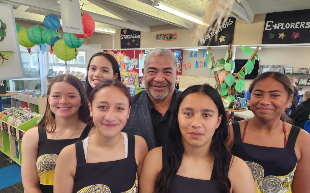 Rangikura School principal Eddie Uluilelata with pupils.