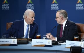 Prime Minister of Australia Anthony Albanese (right) and US President Joe Biden speak during a roundtable meeting with World leaders attending the Asia-Pacific Economic Cooperation (APEC) Leaders' Week in San Francisco, California, on November 16, 2023.