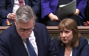 In this video grab taken from footage broadcast by the UK Parliamentary Recording Unit (PRU) via the Parliament TV website on July 2, 2025, Britain's Chancellor of the Exchequer Rachel Reeves appears tearful during the Prime Minister's Questions (PMQ) session in the House of Commons. (Photo by PRU / AFP) / RESTRICTED TO EDITORIAL USE - NO USE FOR ENTERTAINMENT, SATIRICAL, ADVERTISING PURPOSES - MANDATORY CREDIT " AFP PHOTO / PRU "