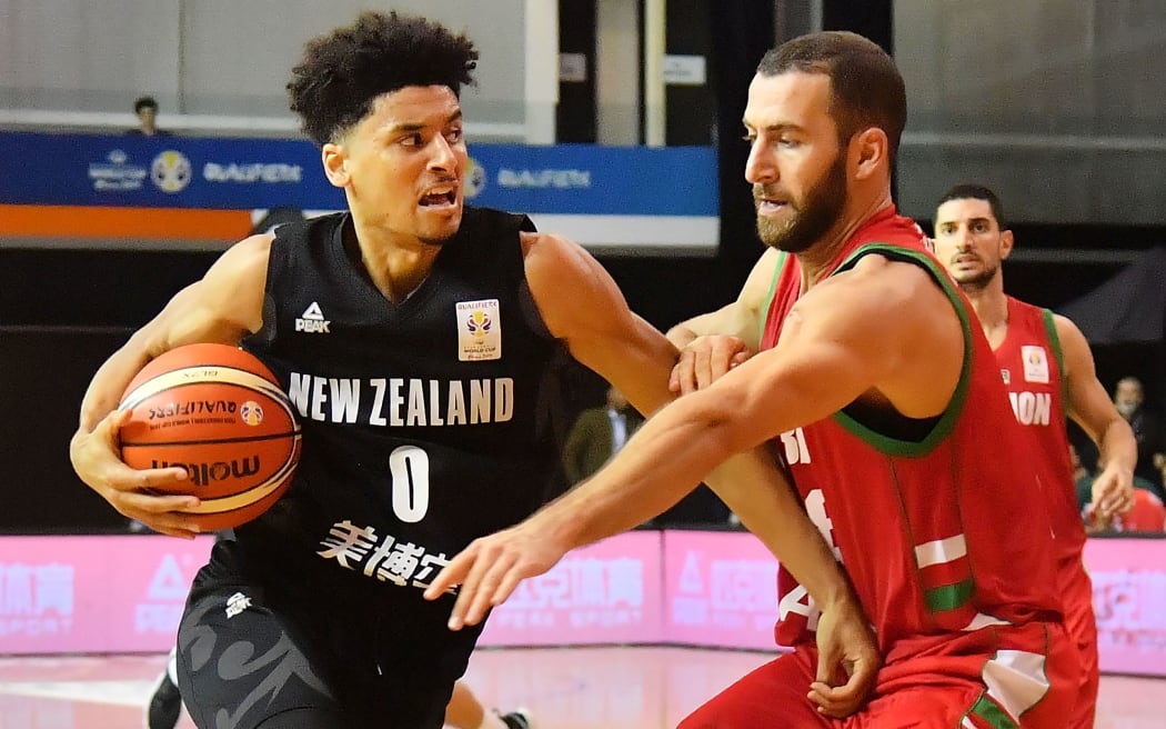 Tall Blacks Tai Webster fends off  Lebanon's Elias Ruston during the Tall Blacks win over Lebanon in Rotorua.