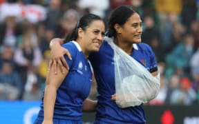 Samoa's Fa'asua Makisi (left) and Christabelle Onesemo-Tuilaepa stand after the Women's Rugby World Cup 2025 Pool A match between England and Samoa.