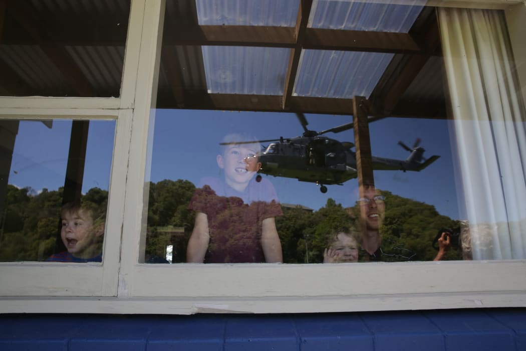 A Defence helicopter nears the home of a Kaikoura Family