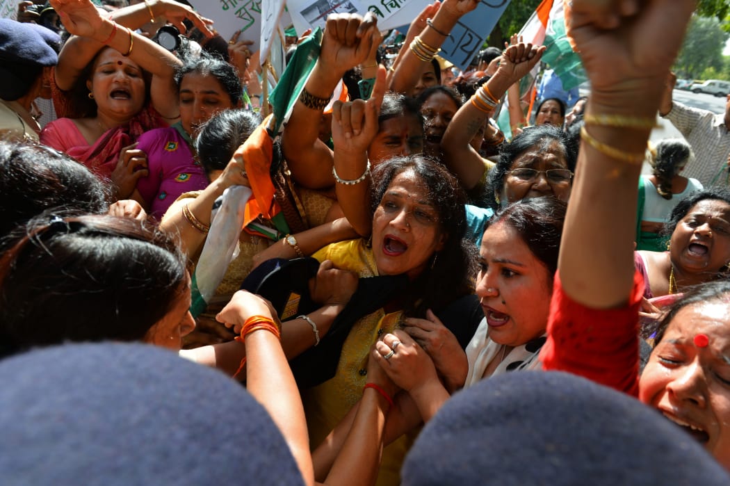 Rape cases have sparked angry protests. This demonstration was prompted by a senior government minister describing a fatal attack in New Delhi  as a "small incident".