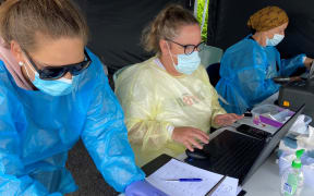 On the laptops at Ngāti Ruanui’s pop-up Covid-19 saliva testing station in Eltham were (from left) Tineka Kumeroa, Justine Stewart and Debbie Ngarewa-Packer.