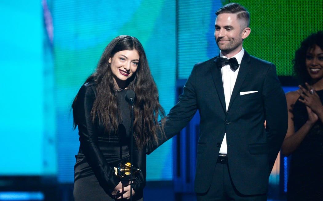 Lorde with producer Joel Little accepting the award for song of the year.