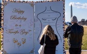 People look at a protest art installation on the National Mall on January 19 in Washington, DC.