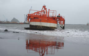 This NZ Steel sand extractor washed up on Ngamotu Beach, Port Taranaki, New Plymouth.