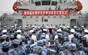 Photo taken on July 31, 2017 shows the opening ceremony of the 4th national military camp for students in Dalian, coastal city of northeast China's Liaoning Province.