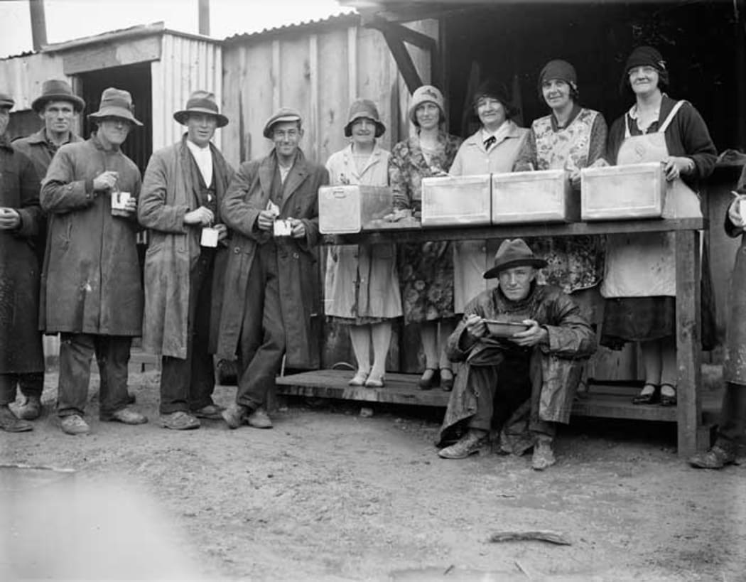For people who lost their jobs and had few savings the early years of the 1930s were tough. Here a group of men queue with their enamel mugs for some hot soup.