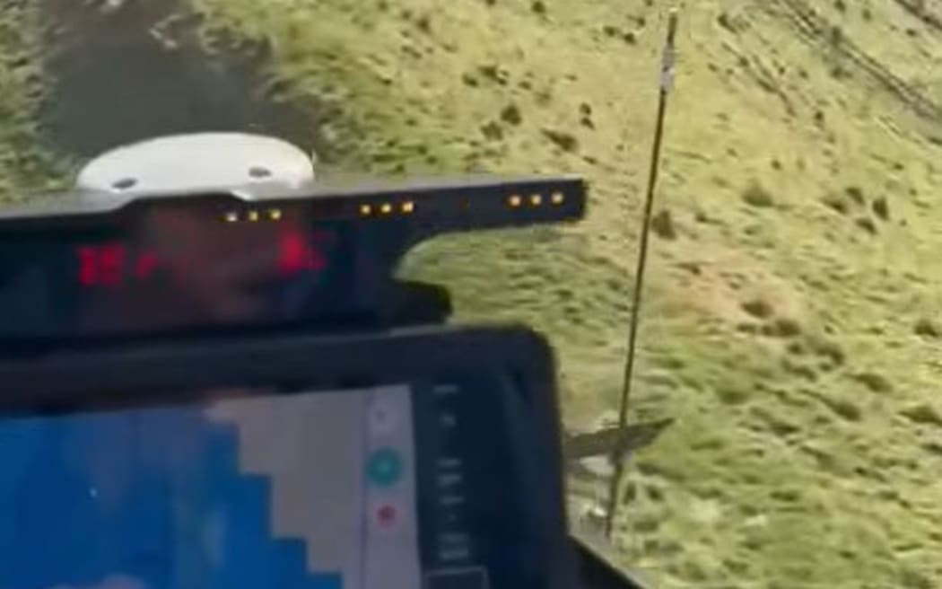 A screen shot from the video posted by a pilot showing their near miss with a radio tower (to the right) which they failed to detect.