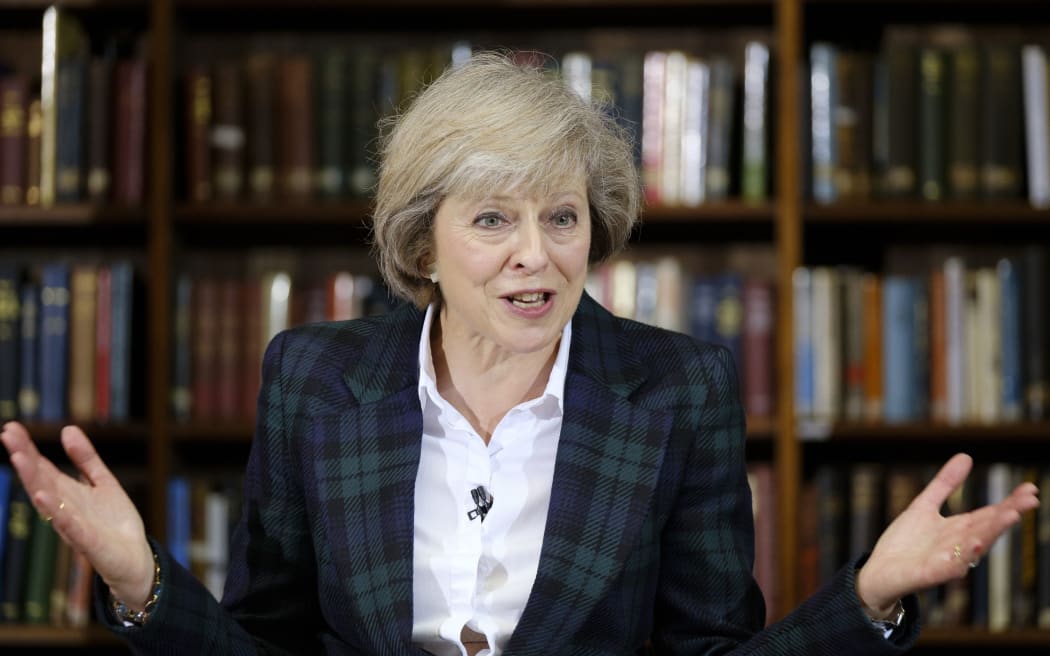 UK Home Secretary Theresa May has won half the votes in the first round of voting among MPs for a new Conservative leader.