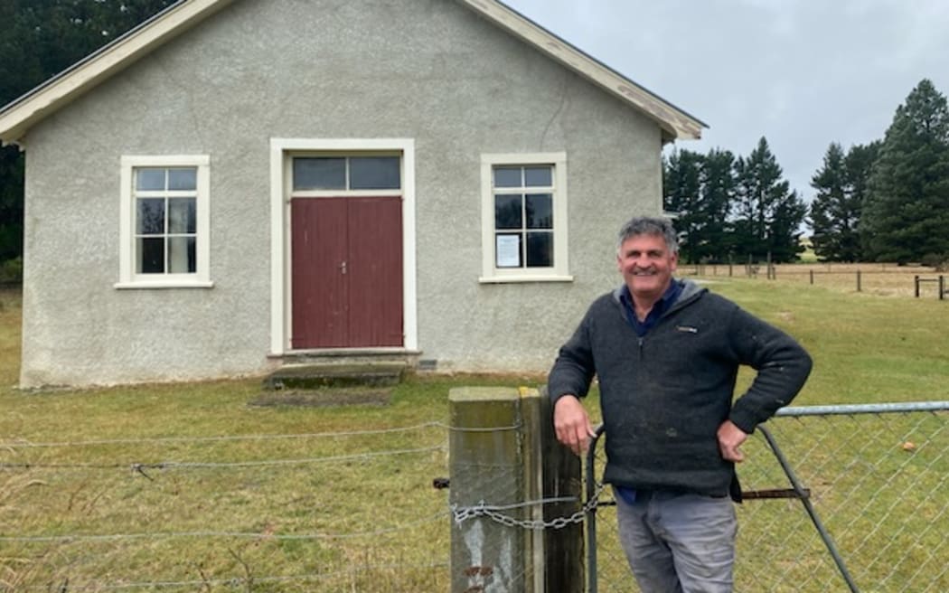 Wedderburn farmer and councillor Stu Duncan standing in front of the 99-year-old Wedderburn Hall