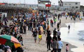 Palestinians gather by the seaside during the Eid al-Fitr in Gaza City on May 26, 2020 amid the coronavirus Covid-19 pandemic.