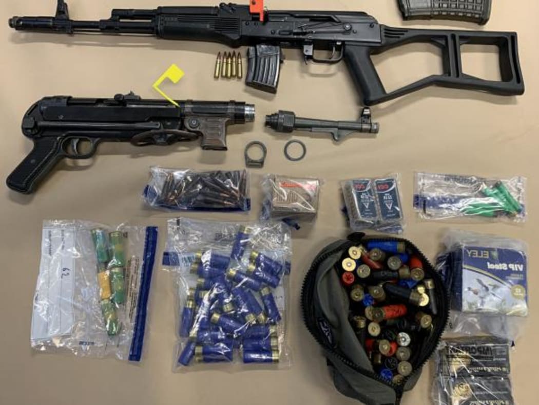 Police recovered an AK-47 and a submachine gun in the raid.