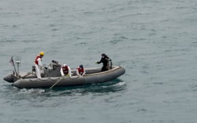 Previous attempts by divers have failed because of zero visibility on the sea floor and bad weather.

AFP PHOTO HANDOUT-US NAVY/Mass Communication Specialist 1st Class Brett Cote"/