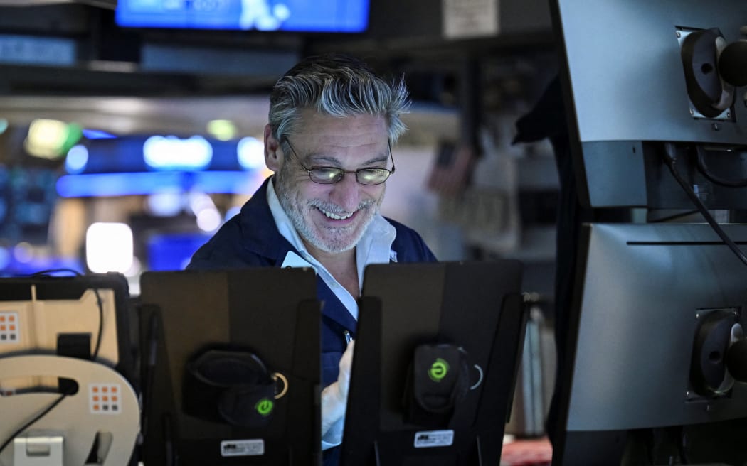 A trader works on the floor of the New York Stock Exchange (NYSE) during afternoon trading on April 9, 2025 in New York. Wall Street stocks rocketed to close solidly higher Wednesday, with dramatic advances on all three major indexes as US President Donald Trump delayed steep new tariffs hours after they took effect. The Dow Jones Industrial Average surged 7.9 percent to 40,608.45, the broad-based S&P 500 Index rallied 9.5 percent to 5,456.90, and the tech-focused Nasdaq Composite Index jumped more than 12.2 percent to 17,124.97. (Photo by ANGELA WEISS / AFP)