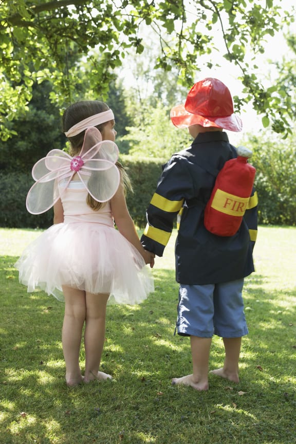 Girl and Boy Playing Dress Up