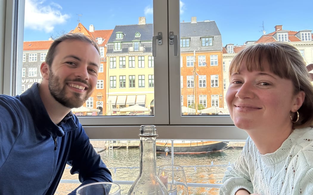 Jack and Nicole with traditional Danish houses in the background