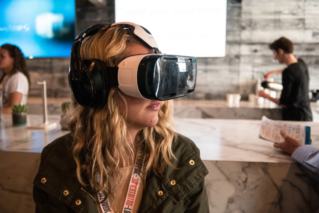 A woman using a VR headset at SXSW, 2015.