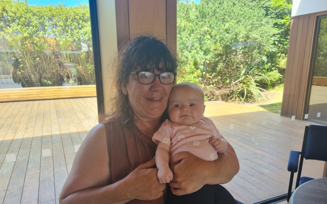 Andrea Morgan, pictured with four-month-old granddaughter Anika-Rose, says the hamper will ensure they can all have a great day on Christmas.
