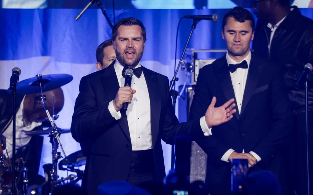 WASHINGTON, DC - JANUARY 19: U.S. Vice President-elect JD Vance (C) on stage with Charlie Kirk during the Turning Point USA Inaugural-Eve Ball at the Salamander Hotel on January 19, 2025 in Washington, DC. Donald Trump will be sworn in as the 47th U.S. president on January 20.   Samuel Corum/Getty Images/AFP (Photo by Samuel Corum / GETTY IMAGES NORTH AMERICA / Getty Images via AFP)