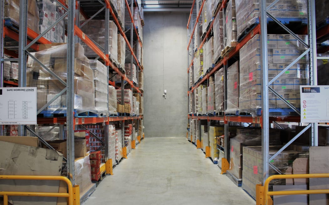 Shelves of donated food in the south Auckland storage and operations warehouse of the New Zealand Food Network.