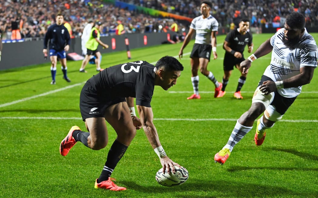 Rieko Ioane scores a try.