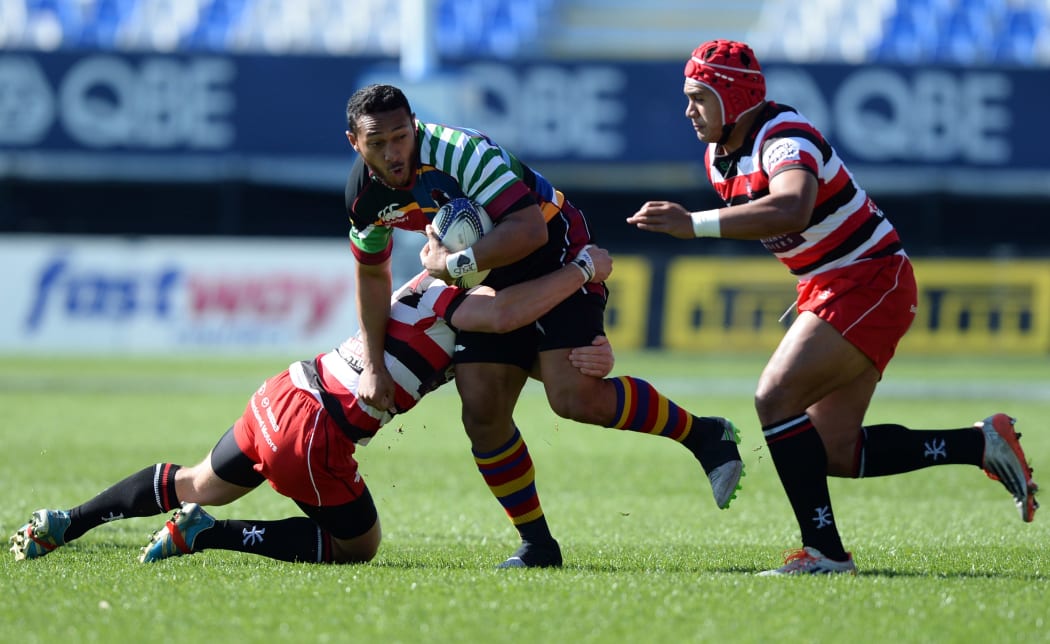 North Harbour's Nafi Tuitavake tackled by Counties Manukau's Richard Judd during the ITM Cup match between North Harbour and Counties Manukau. QBE Stadium, Auckland, Saturday 12 September 2015. Copyright Photo: Raghavan Venugopal / www.photosport.nz