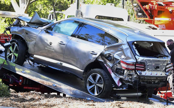 A tow truck recovers the vehicle driven by golfer Tiger Woods in Rancho Palos Verdes, California.