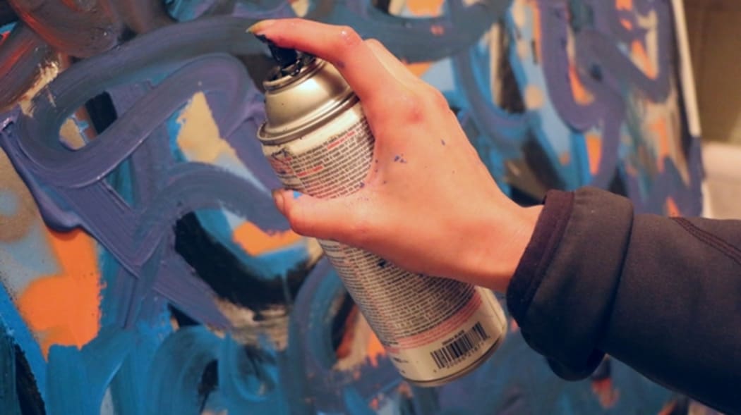 Spray painting a wall