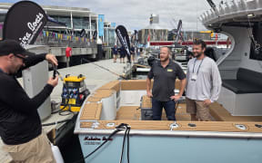 Act MP Cameron Luxton poses for a photo with a Whangarei boat builder