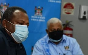 Defence Minister Inia Seruiratu and PM Frank Bainimarama.