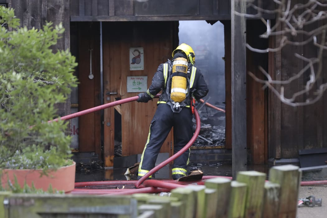 A firefighter works to control the fire at London Zoo in London on December 23, 2017.
