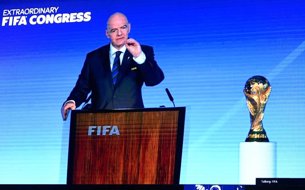 A speech by FIFA president Gianni Infantino is broadcasted on a screen at a ceremony in Saudi capital Riyadh during the FIFA congress for the hosting rights for the 2034 World Cup.