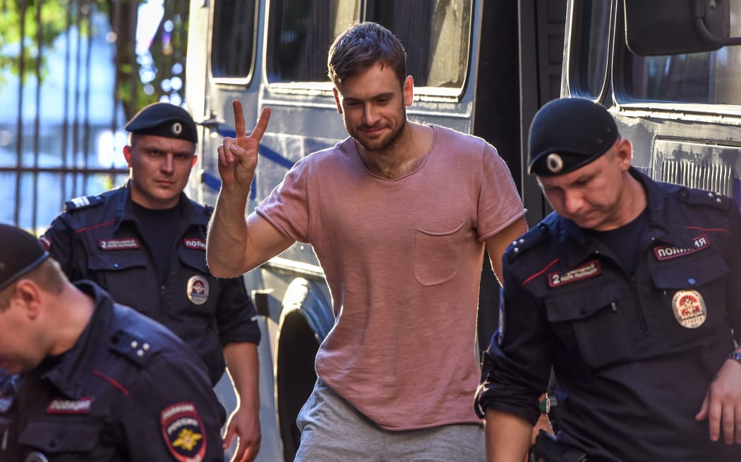 Member of the Pussy Riot punk group Pyotr Verzilov, centre