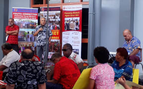Fiji Labour Party leader Mahendra Chaudhry addresses the union rally in Suva last Saturday. At left is Fiji Teachers Union general secretary Agni Deo.
