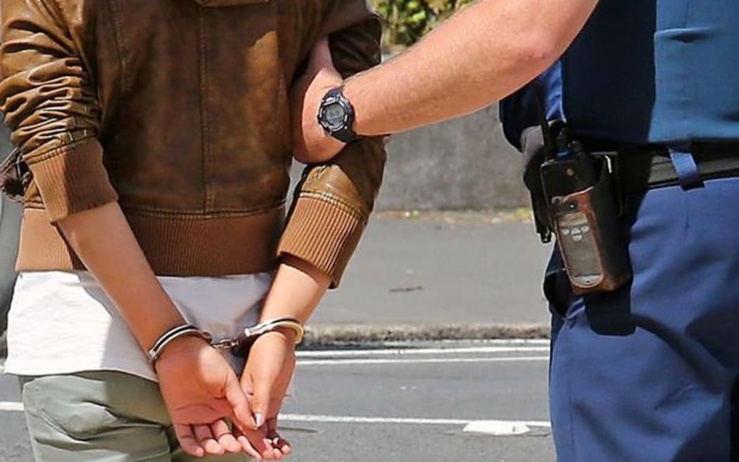 generic arrest person in handcuffs
