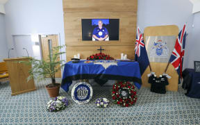 The coffin of New Zealand-born Metropolitan Police officer Sergeant Matt Ratana is surrounded by floral tributes ahead of his funeral service in Shoreham-by-Sea, south England.