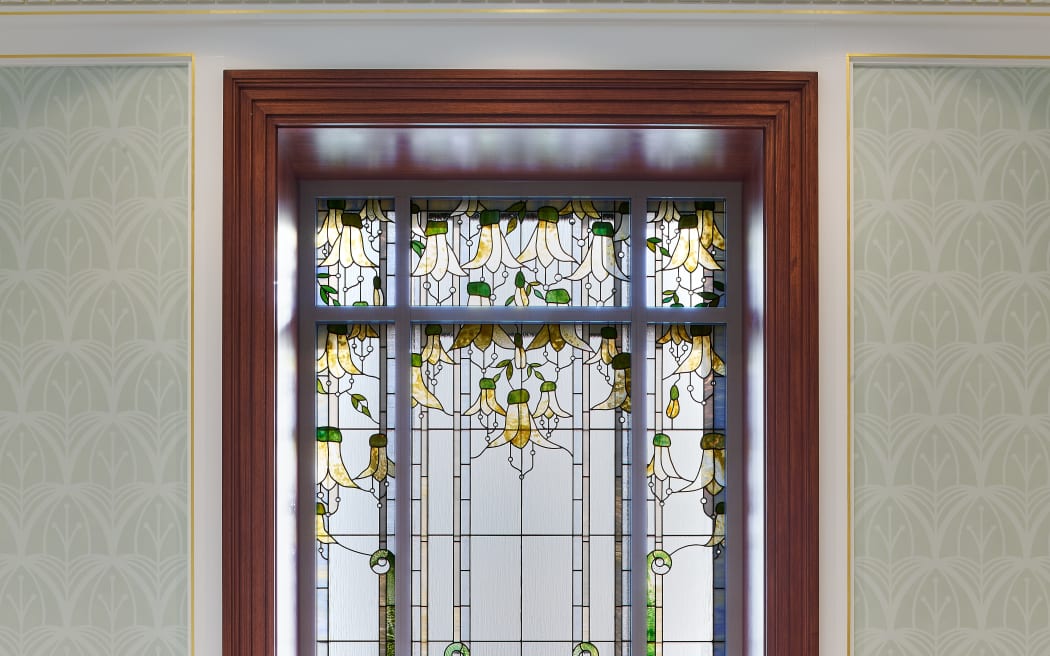 Large stained glass windows feature throughout the temple