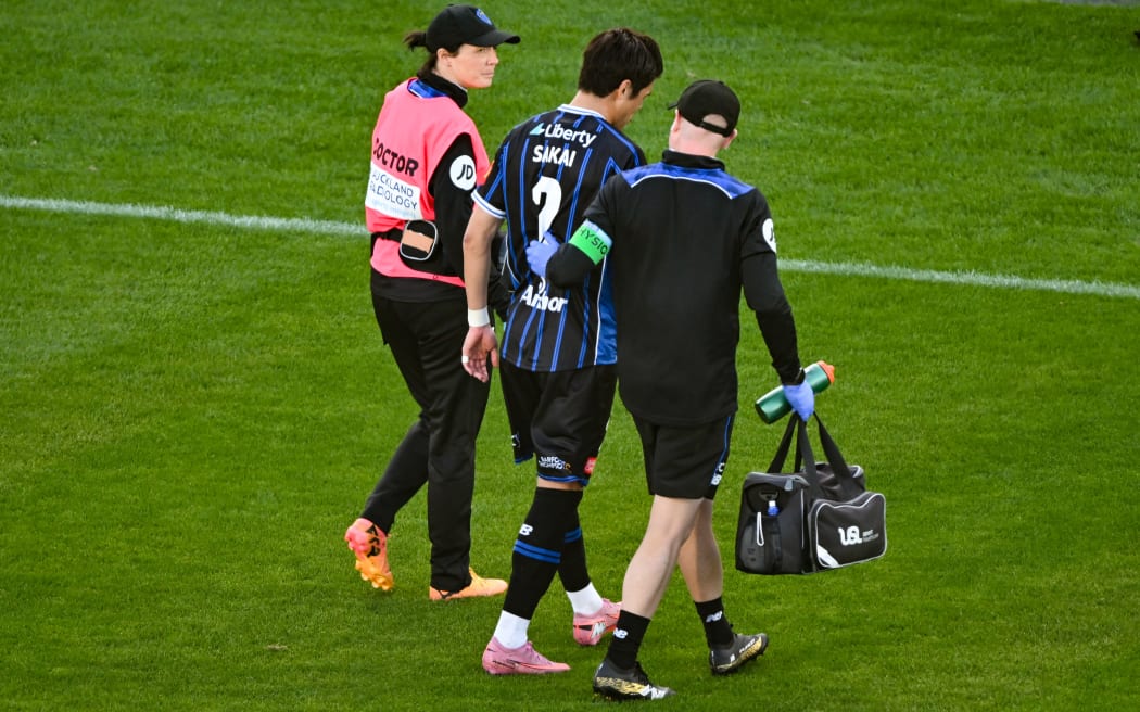 Hiroki Sakai of Auckland FC goes off with an injury.