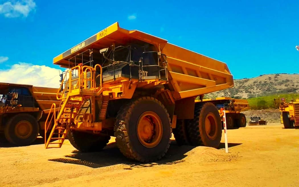 Idle nickel transport trucks lined up on Koniambo mining site in New Caledonia - Photo RRB